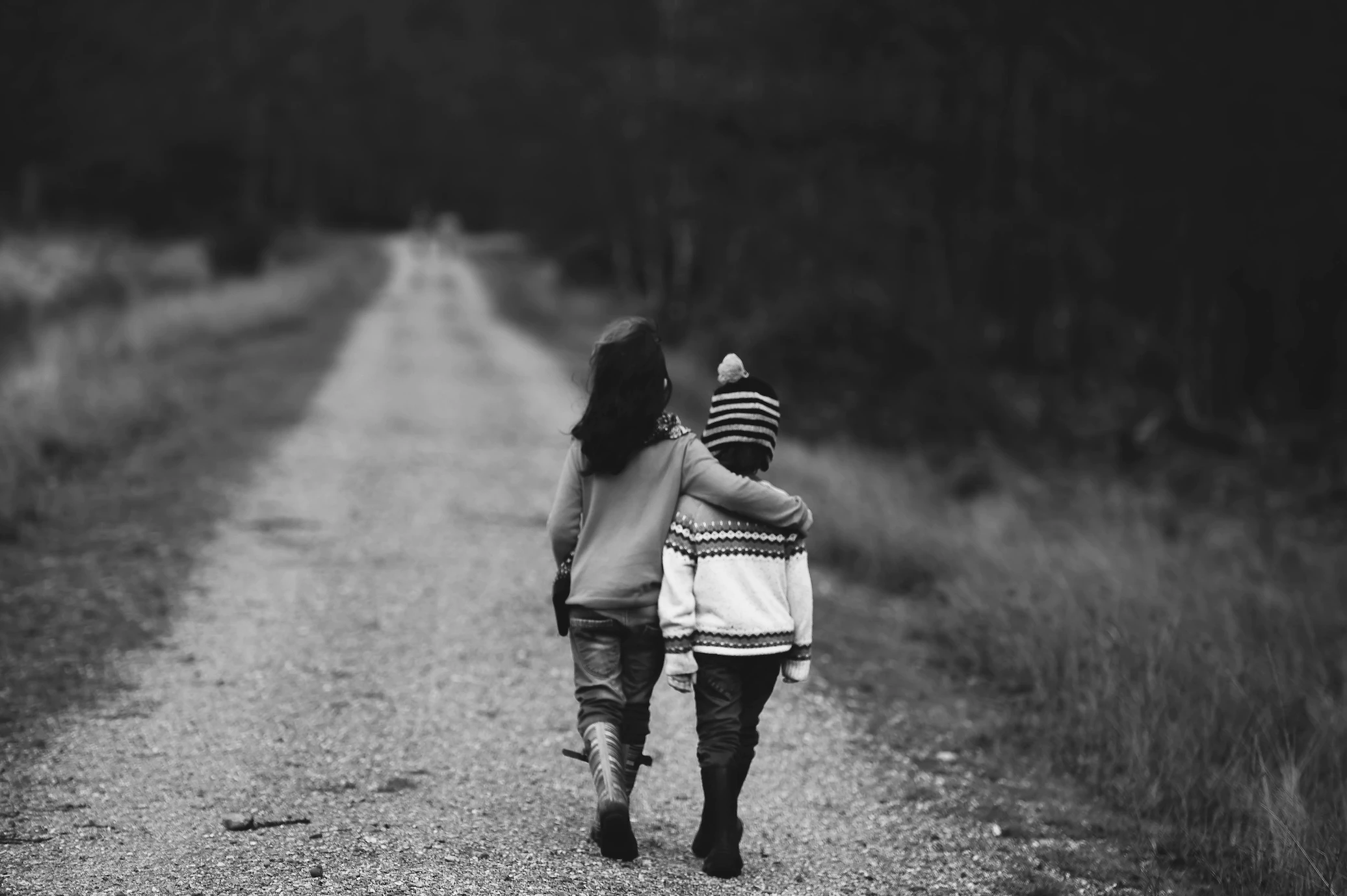 Children walking together on a road